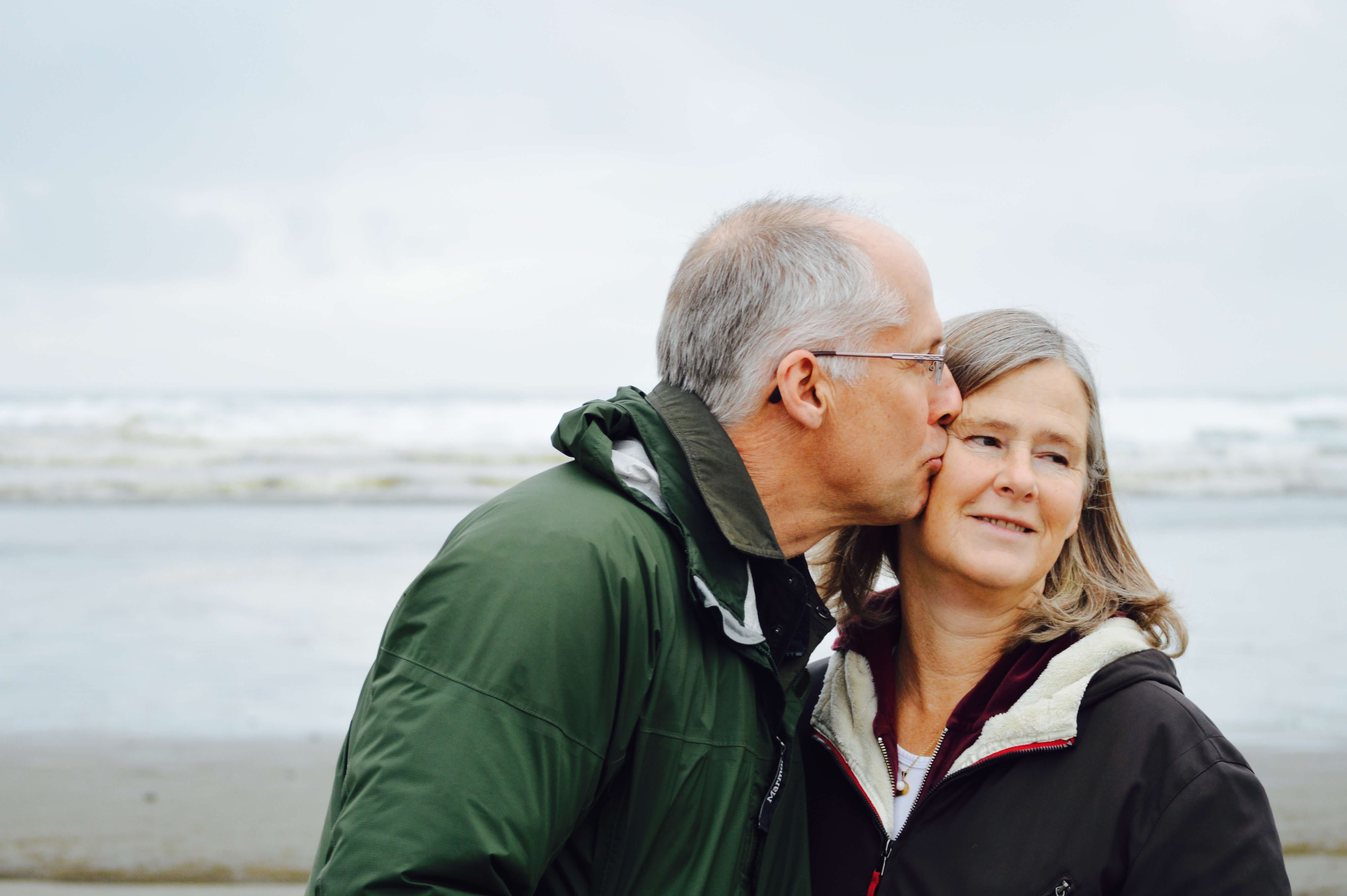 Husband kissing wife